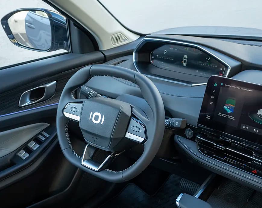 View of a luxurious car interior with leather seats and ambient lighting.